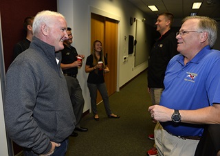 Wings of Carolina Flying Club's Jay Nabors, a 2015 Flight Training Excellence Awards winner, talks with AOPA President Mark Baker during an informal breakfast before an award ceremony at AOPA headquarters in Frederick, Maryland, Dec. 2. Photo by David Tulis.