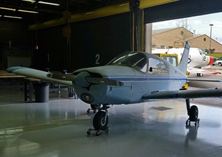 A donated Piper Cherokee 140 sits in Pensacola, Florida’s George Stone Technical Center Dec. 14 near a North American T-39 jet trainer after the adult education school recently launched a two-year FAA-certified aircraft maintenance training program. Enrollment is open until Jan. 13, 2016. Photo courtesy of Bill Davis.
