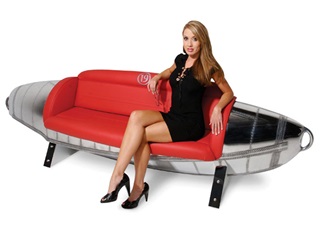 MotoArt has transformed a Grumman Albatross float tank into a couch accented in red over its mirror-polished aircraft float frame. Photo courtesy of MotoArt.