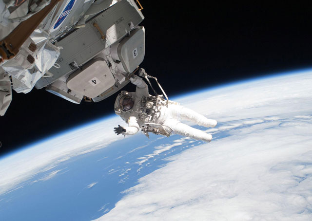 Astronaut Nicholas Patrick participates in the STS-130 mission's third and final spacewalk as construction and maintenance continue on the International Space Station. During the spacewalk, Patrick and astronaut Robert Behnken completed all of their planned tasks, removing insulation blankets and launch restraint bolts from each of the Cupola's seven windows. NASA photo, 2010.