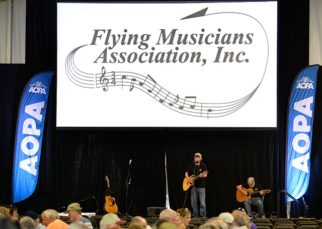 Flying Musicians Association members play music during the Barnstormers Party at AOPA’s Homecoming Fly-In June 5, in Frederick, Maryland. Photo by David Tulis.