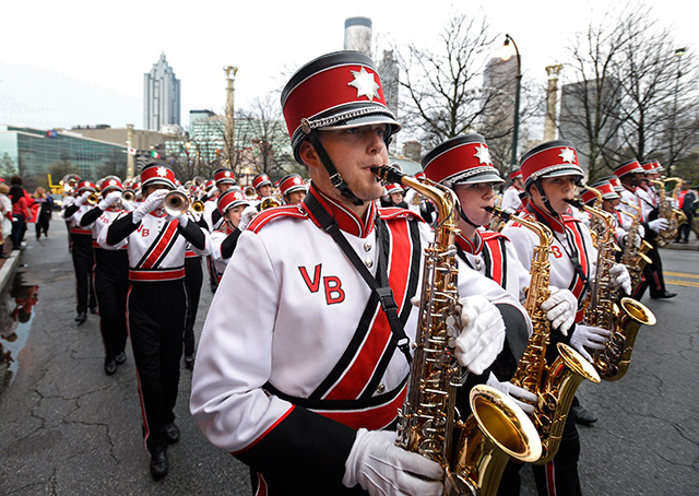  Flying Musicians Association 2015 solo scholarship winner and Vero Beach, Florida, high school saxophonist Drew Medina participates in the Chick-fil-A Peach Bowl Parade, Dec. 31, in Atlanta. Photo by David Tulis.