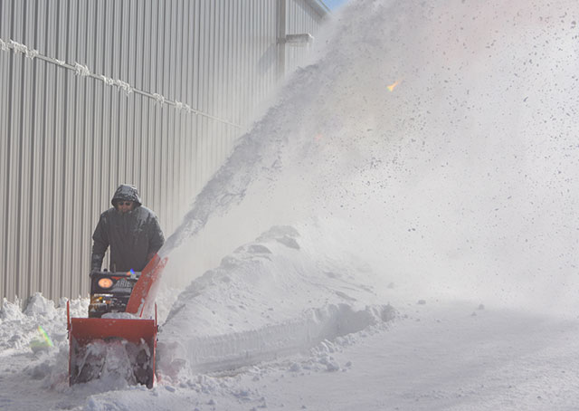 Snow drifted unhelpfully against hangar doors in Marshfield, Mass., though crews had a good time clearing it. Photo by Ann Pollard, Shoreline Aviation Inc. 