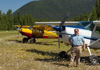 John Kounis with his Cessna 185 after some backcountry flying.