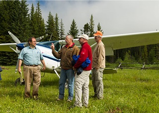 John Kounis, left, talks backcountry flying strategy.