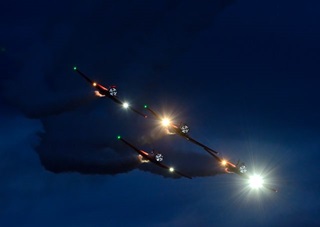 Four T-6s turn onto a downline. Photo by Mike Collins.