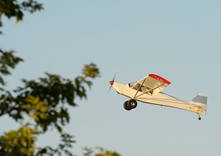 An airaft climbs near the ultralight area.