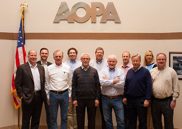 Front row, from left: Jim Coon, AOPA senior vice president of government affairs and advocacy; Ken Mead, AOPA general counsel; Tim Fortune, AOPA chief administrative officer; Mark Baker, AOPA president; Jack Pelton, EAA chairman of the board; Sean Elliott, EAA vice president of advocacy and safety. Back row, from left: Jiri Marousek, AOPA vice president of marketing; Dave Chaimson, EAA vice president of marketing and business development; Rick Larsen, EAA vice president of communities and member programs; Ian Twombly, editor of AOPA Pilot and Flight Training magazines; and Katie Pribyl, AOPA senior vice president of communications.