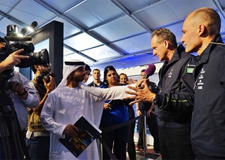 Solar Impulse pilots Bertrand Picard, far right, and André Borschberg, second from right, address the media prior to their March 9 departure. Photo courtesy of Solar Impulse.