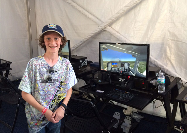 Trevor Simoneau stopped by the AOPA tent at Sun 'n Fun to use the Redbird Jay simulators and show off his custom-printed T-shirt.