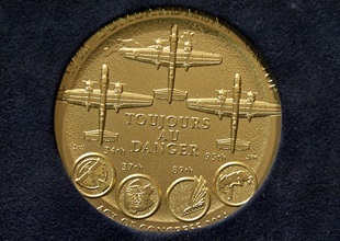 The back of the Doolittle Tokyo Raiders' Congressional Gold Medal features three B-25s, the patches for each of the four squadrons involved in the raid, and an outline of Japan. Photo courtesy of the National Museum of the U.S. Air Force.