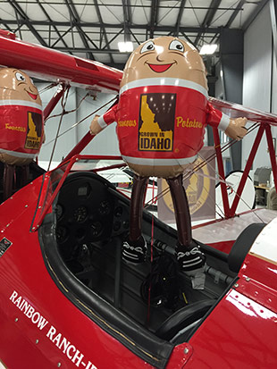 The Idaho Potato Commission’s “Flying Farmer” aircraft and IPC mascot “Spuddy Buddy.”