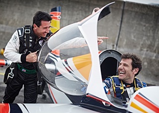 Michael Goulian laughs with Juan Velarde of Spain during the qualifying of the second stage of the Red Bull Air Race World Championship in Chiba, Japan. Photo by Balazs Gardi/Red Bull Content Pool.