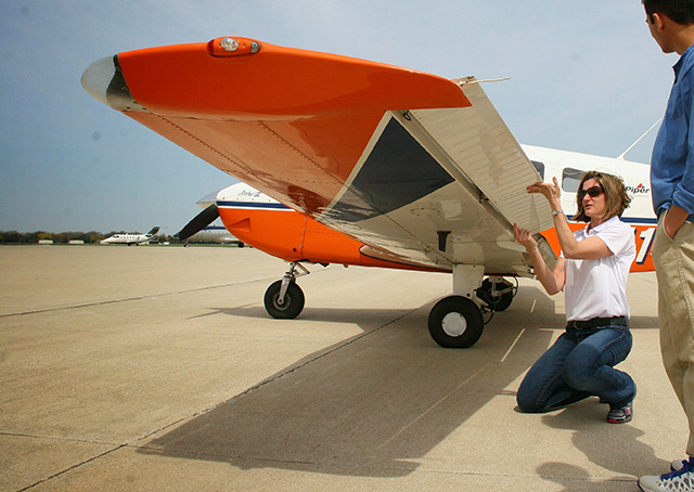 A Parkland College aviator preflights one of the school's Piper Archer III aircraft. Photo courtesy of Parkland College.
