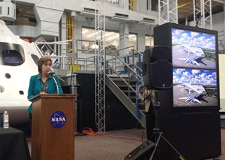Johnson Space Center Director Ellen Ochoa, a former astronaut, speaks during a Nov. 4 event that included signing an agreement to share resources with Houston Area Airports. A rendering of the future space terminal at Ellington Airport is on screen in the background. Photo by Yasmina Platt. 