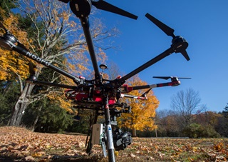 One of the Next Generation Aviation Services octocopters, a customized assembly of systems and parts built on a DJI S-1000 chassis and a gimbal-stabilized camera system. Like all (legal) commercial drones, it is registered with the FAA. Jim Moore photo. 