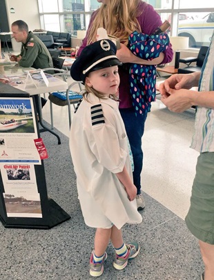 A young participant tries on pilot gear at the Girls in Aviation Day event at Raleigh-Durham International Airport in North Carolina. Photo courtesy Sarina Houston.