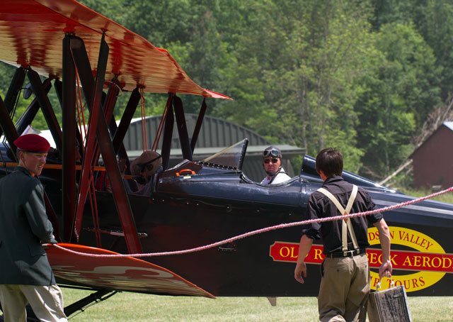 Quick action by firefighters, staff and a passerby helped save Old Rhinebeck Aerodrome aircraft, such as this New Standard biplane used to give rides, from damage in the Aug. 20 fire. AOPA file photo.
