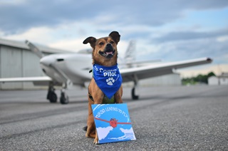 Turbo the Flying Dog displays "Turbo Learns to Fly," the latest installment of the children's book series. 