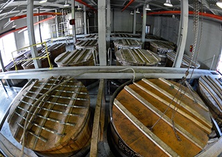Charcoal mellowing of Jack Daniel whiskey is a unique part of the distilling process at the Lynchburg, Tennessee, distillery, not far from AOPA's Tullahoma Fly-In. Photo by David Tulis