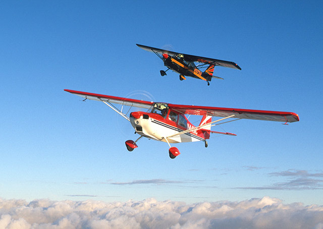 The lead airplane pictured is an American Champion 7GCAA Ultimate Adventure. AOPA file photo.