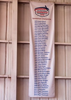 Sportsman champions have their names on a banner at the U.S. National Aerobatic Championships.