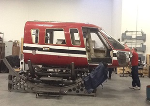The Sikorsky S-76 fuselage was mounted to the simulator base before the restoration began.
