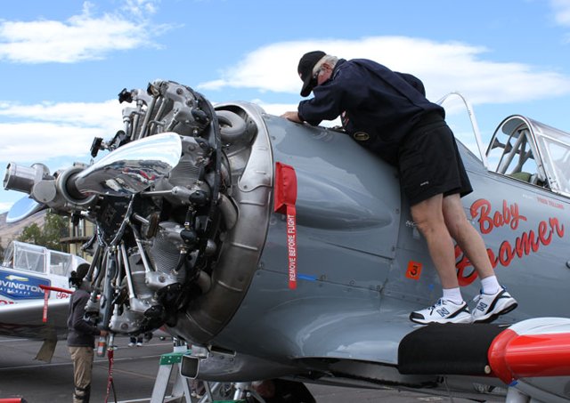 Gene McNeely's AT-6, Baby Boomer, gets some attention in the Reno pits. Robert Fisher photo.
