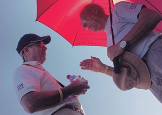 U.S. Unlimited Aerobatic Team coach Claude “Coco” Bessiere, right, talks with team member Brett Hunter during the World Aerobatic Championships. Photo by Eric Lentz-Gauthier.