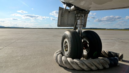 Pieces of thick rope are used as chocks at Goose Bay Airport in the Canadian province of Newfoundland and Labrador. Photo by Mike Collins.