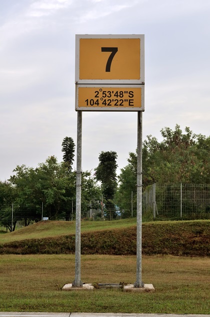 Before leaving Minangkabau International Airport in West Sumatra, Indonesia, we noticed this position sign at our parking ramp that placed us south of the equator. We had missed the crossing! Photo by Mike Collins.