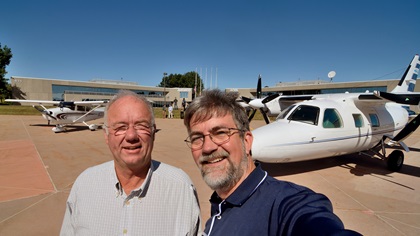 Mike Laver, left, and Mike Collins pose on the ramp at Frederick Municipal Airport at the conclusion of their journey. Well, not quite—Laver has one more leg to fly, to his home in South Carolina. Photo by Mike Collins.