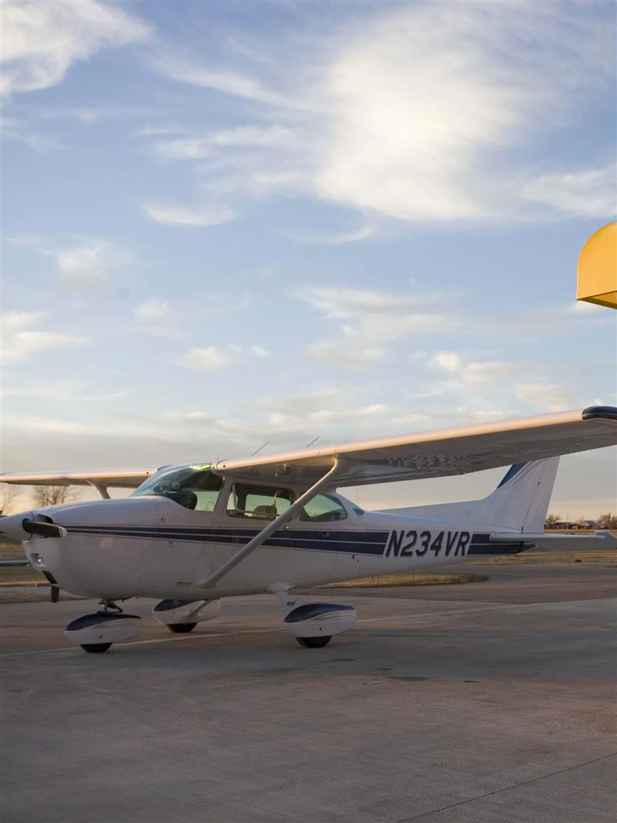 A Cessna 172 owner fuels his aircraft at a self serve fuel island.
Benton, KS   USA
Image#: 05-479_023.CR2
Camera: Canon EOS-1Ds Mark II 
http://mikefizer.com    mike@mikefizer.com