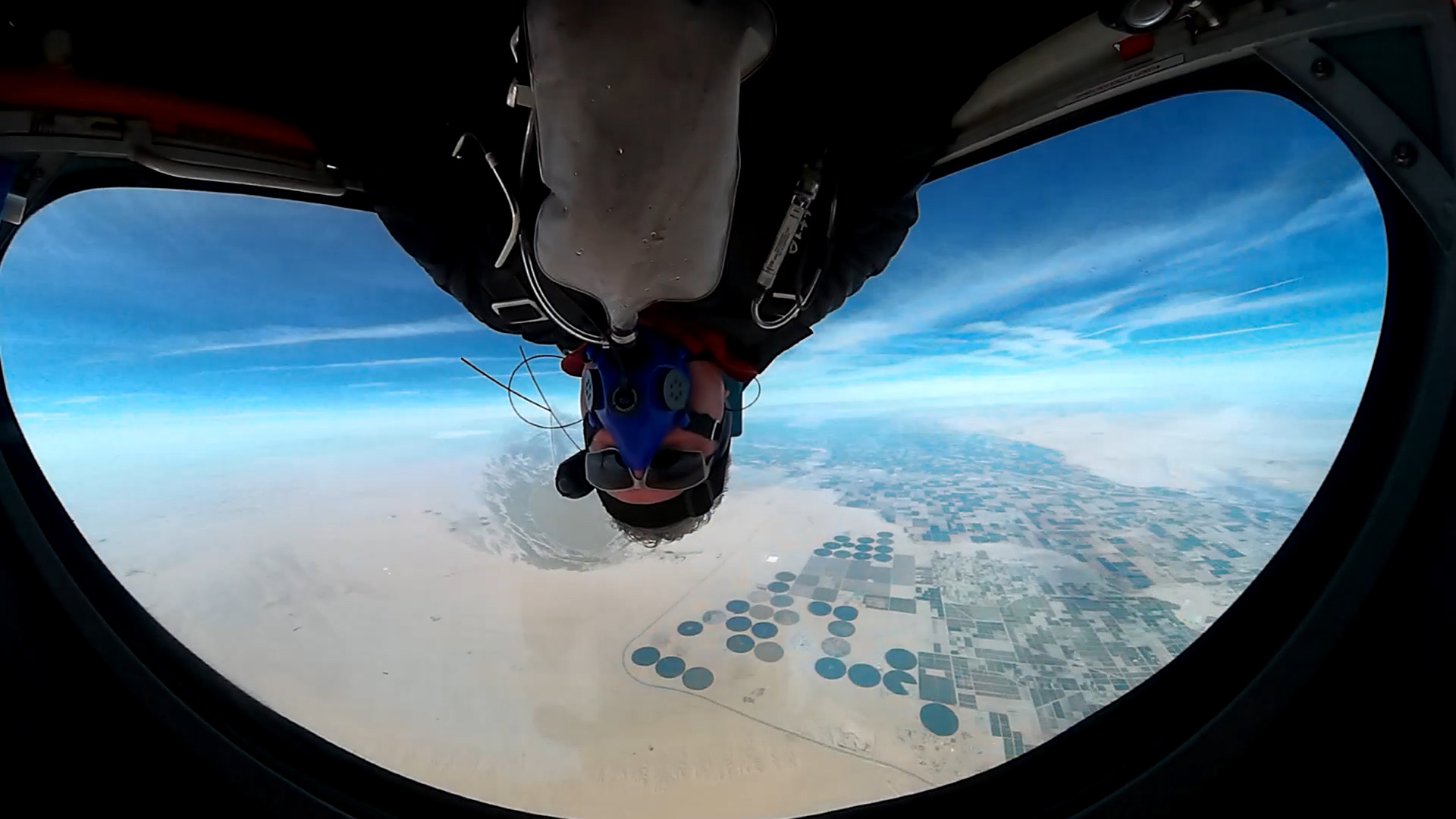 PIcture of pilot demonstrating inverted flight by flying upside down.